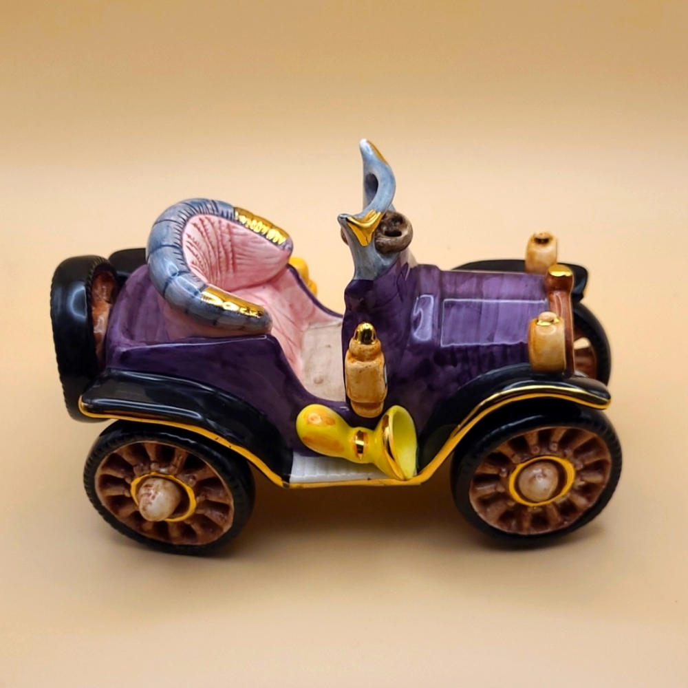 J Willfred handpainted jalopy car for Charles Sadek Imports Co